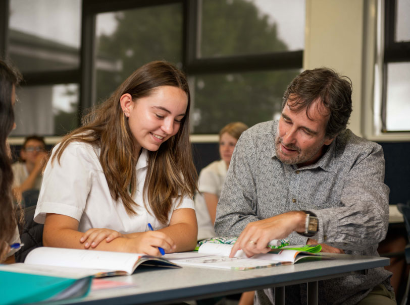 Teacher working with student