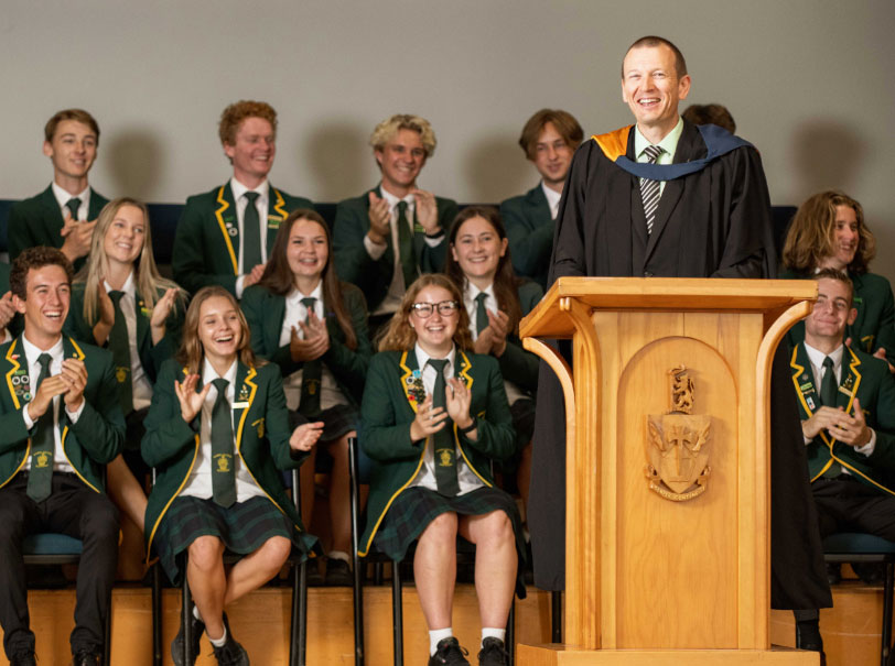 Principal addressing school assembly