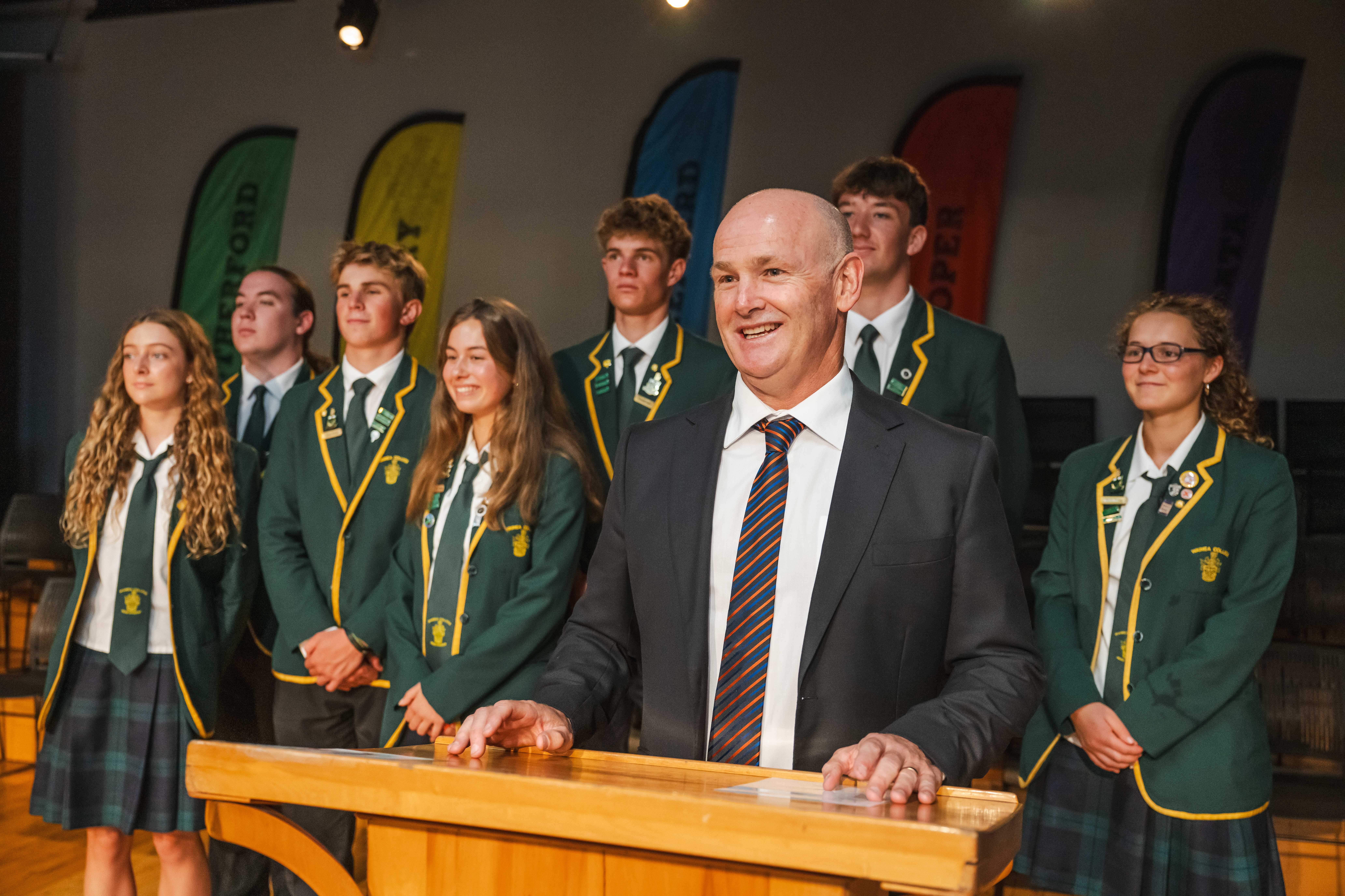 Principal addressing school assembly